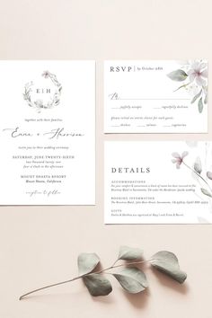 wedding stationery with flowers and greenery on the front, in grey and white