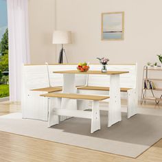 a dining table and bench set in a room