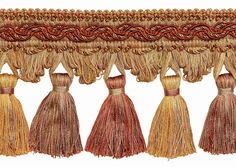 four tassels hanging from the side of a curtain with braiding on it