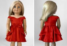 the doll is wearing a red dress with a bow at the waist, and has blonde hair