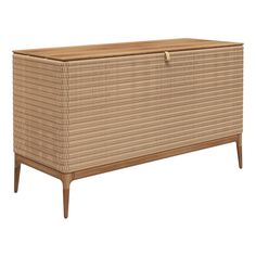 a brown wicker chest with wooden legs