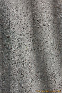 an overhead view of the surface of a carpet with small dots and lines on it