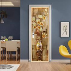 a vase with white flowers is on the door to a dining room that has blue walls and wooden floors