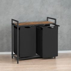 a black trash can with two bins and a wooden top