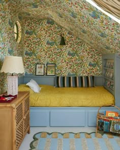 a bed room with a neatly made bed and a book shelf