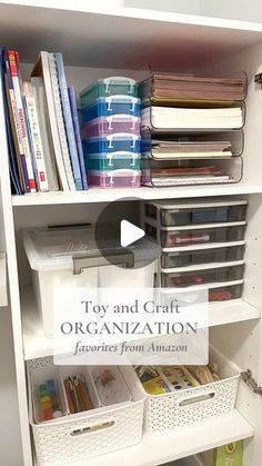 an organized closet with white shelves and plastic bins filled with books, binders, and other office supplies