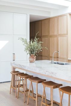 the instagram page shows an image of a kitchen island with stools in front of it