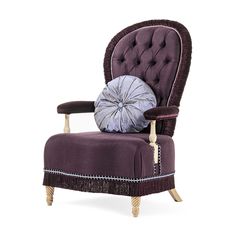 a purple chair with a pillow on top of it