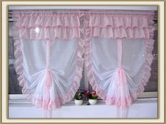 two windows with pink ruffled curtains and flower vases on the window sill