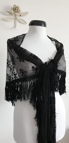 "Vintage 1930s black lace shawl with floral embroidery and black fringe. ....M E A S U R E M E N T.... 101\" in full width 25\" from center of straight edge to tip of fringe 4\" fringe brand/maker: n/a condition; excellent( see last photo ) Shipping Is Avaliable Worldwide. Every item is carefully shipped Priority via Air Mail - shipping takes from 7 to 14 working days, depending on your location. Shipping includes Tracking. Come and check out our shop to see all items! https://www.etsy.com/shop/ 1930s Gothic Fashion, Black Lace Shawl, Lace Shawl Outfit, Black Shawl Outfit, Gothic Wedding Guest Outfit, Black Vintage Dresses, Shawl Outfit, Piano Shawl, Fox Fur Scarf