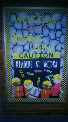 a sign on the side of a building that reads, welcome to the reading zone caution readers at work