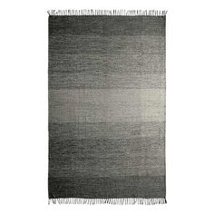 a black and white rug with fringes on it