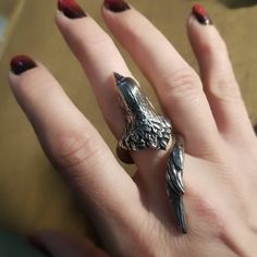 "Handcrafted lead-free pewter adjustable bird wrap ring. This ring is very adjustable but it's best if we set it close to your size. Also, the tail feathers will be slightly trimmed for sizes 8 & below. The pics with the black onyx eyes are an example of the trimmed. 2\" long or less depending on ring size Bird body ¾\" wide All pieces are made-to-order despite the \"in stock\" number in the listing. Time frame varies from piece to piece so please message us if you need something by a certai Adjustable Silver Jewelry With Bird Design, Crow Ring, Raven Ring, Onyx Eyes, Crow Jewelry, Raven Jewelry, Bird Ring, Raven Necklace, Norse Jewelry