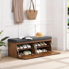 a wooden bench with shoes on it in front of a door