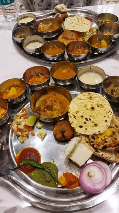 two trays filled with different types of food