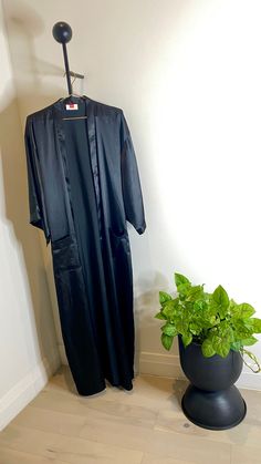 Feel Sultry & Sexy in The Noire Robe with matching scarf that is 18" inches wide and 62" inches long. This is a full length black satin robe that measures 57" inches long with inner and outer waist ties, soft silky satin that compliments the skin and hair. Available in Standard O/S Size (S-L) and Plus O/S Size (XL-3X) Slay Tip: Pair this bundle with The Black Baddie Bralette and the Black FABLeisure Leggings Available in Plus ( XL-3X) & Standard (S-L) Size M-L can go a size up to plus for oversi Black Satin Robe, Black Satin, Waist Tie, Bralette, Full Length, Satin, Leggings, Skin, Hair