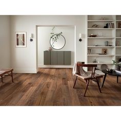 a living room with wooden floors and white walls