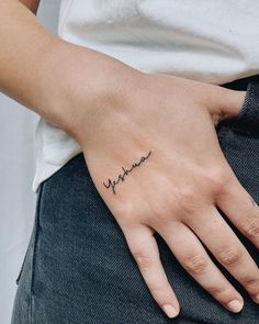 a woman's hand with a small tattoo on her left wrist and the word hannah written in cursive font