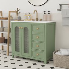 a bathroom with a green cabinet and sink