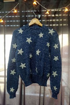 Handmade blue sweater inspired by the movie Coraline, made by my mom @creacionesnuditos on instagram! It was made on a knitting machine + hand sewn and knitted stars.  Made of blue baby swan 100% acrylic yarn, and gray wool (50% wool, 50% acrylic fiber), and shiny silver lurex yarn.  It has a total of 48 hand knitted stars sewn both in the front and the back, as well as on the sleeves. SIZE Please, make sure to take your own measurements right so you can pick the best size for you! The sweater in the photos is an S. Don't hesitate to contact me if you have any questions!  IT SHOULD BE WASHED BY HAND WITH COLD WATER OR ON THE WOOL SETTING (GENTLE ACTION UNDER 30oC). Coraline Star Sweater Costume, Coraline Jumper, Star Aesthetic Outfit, Coraline Star Sweater, Coraline Sweater, Coraline Cosplay, Stars Sweater, Russia Fashion, Baby Swan