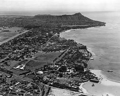 an aerial view of a city and the ocean