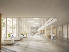 an empty lobby with lots of windows and people walking through the area on either side