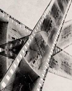 a black and white photo of an old film strip with multiple images on the side