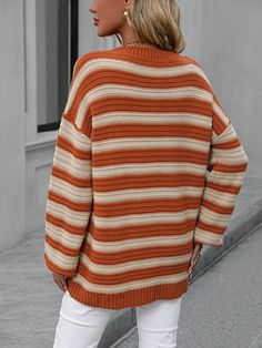 This Milton Striped Pullover Knit Sweater will be the perfect addition to your wardrobe for a unique, luxurious look. The dark orange stripe is subtle and sophisticated, with beige slim stripes that catch the eye. Soft knit fabric ensures comfortable all-day wear. Take your style to the next level with this exclusive pullover. Size Guide: Model is 5’6” tall, and has a 32.4” bust, 24.2”waist, & 35.2” hips. She is wearing a S / US 4 / AU 8. This sweater is true to size. Material: 100% Acrylic Key Striped Sweater For Layering In Fall, Knit Sweater With Horizontal Stripes For Layering, Chic Striped Sweater For Fall, Striped Knit Sweater For Layering, Striped Long Sleeve Sweater For Fall, Orange Ribbed Winter Sweater, Orange Sweater For Fall Layering, Orange Sweater For Layering In Fall, Chic Orange Long Sleeve Sweater