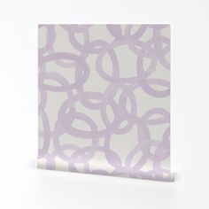 a white and purple wallpaper with circles on the bottom half of it, against a white background