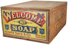 an old wooden box that says welcome soap