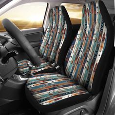 the interior of a car with two front seats covered in southwestern style fabric and colorful strips