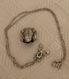 Vintage frog jewelry. Not a matching set, but cute together. Frog pin marked Danforth pewter 1993, almost one inch. Necklace is unsigned silver tone with turquoise colored accent. Necklace measures 16 inches with a small half inch frog. Perfect for the frog collector. Preowned. Frog Pin, Vintage Frog, Frog Jewelry, Frog Pins, Lovers Necklace, The Frog, One Inch, Turquoise Color, Accent Colors