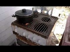 an old stove with a pot on top