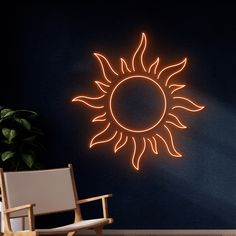 a wall with a neon sun on it and a chair in the corner next to it