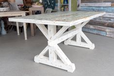 an old wooden table is sitting in a room