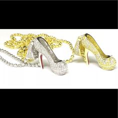 three pairs of high heeled shoes with chains