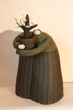 a small pot with a tree in it