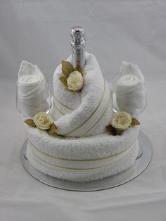 there is a white cake with bananas on the top and gold buttons on the bottom