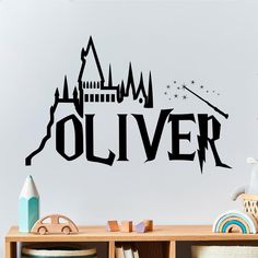 a wall decal with the word'olliver'in front of a castle