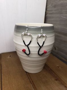 Tiny dangle stethoscope beaded earrings. Beaded Stethoscope, Nurse Earrings, Bead Jewellery, Oklahoma City, Diy Earrings, Diy Beads, Oklahoma, Beaded Earrings, Bead Work