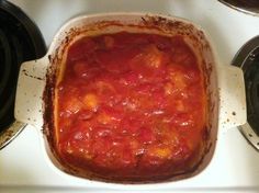 a casserole dish is sitting on top of the stove, ready to be cooked