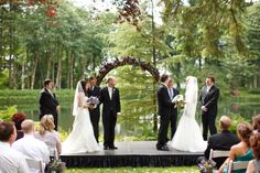 a bride and groom standing at the end of their wedding ceremony