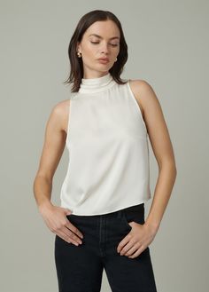 ECRU Chic High Neck Tank Top For Night Out, Classic Sleeveless Top For Night Out, Elegant High Neck Silk Top, Chic High Neck Tank Top, Sleeveless Silk Halter Top, Chic High Neck Silk Top, Chic Silk High Neck Top, Elegant Stretch Halter Top Sleeveless, Elegant Stretch Halter Sleeveless Top