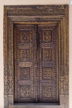 an old wooden door with intricate carvings on it