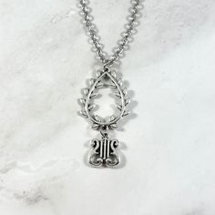 This beautiful chain necklace is the perfect way to express your affinity for Apollo. Made with a laurel wreath and lyre charm.  Secures with a lobster clasp. Chain is stainless steel and is available in a variety of lengths. (A two inch extender can be added to the end upon request.) Charm are zinc alloy. Chain is stainless steel. All materials are lead and nickel free. Comes in a jewelry box so it's ready to be given as a gift. Have a idea for a custom order? I'd love to hear it! Just click the request custom order button to send me a message! Greek Mythology, Greek Mythology Jewelry, Mythology Jewelry, Laurel Wreath, To The End, Chains Necklace, Zinc Alloy, Lobster Clasp, Necklace Lengths