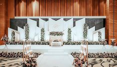 a wedding ceremony setup with flowers and candles