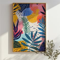 a painting hanging on the wall next to a plant