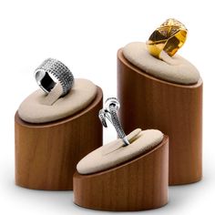 two rings sitting on top of wooden boxes