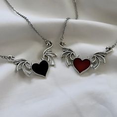 These matching silver heart necklaces feature gothic black & red heart wing pendants, representing grunge jewelry, perfect for gifting to your best friend or girlfriend, particularly those who cherish unique gothic accessories. 𝐃𝐄𝐓𝐀𝐈𝐋𝐒:  ⭐️ Necklace lengths available 14" 16" 18" ⭐️ Pendant size is 2 1/8" x 7/8"  ⭐️ The heart wing pendants are silver plated over alloy. The chain necklace is made up of high quality stainless steel, made to last long with proper care ⭐️ The cutest best frien Heart Stone Jewelry, Black Heart Jewelry, Best Friend Matching Jewelry, Vampire Jewelry Aesthetic, Matching Jewelry Best Friends, Grunge Jewelry Necklaces, Grunge Gifts Ideas, Grunge Jewellery, Gothic Things