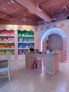 the inside of a candy shop with pink walls and white floors, decorated in pastel colors